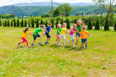 active children playing yard games nature stock  creative market