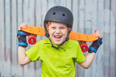 boy  helmet posing  skateboard stock photo image  face