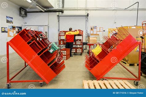 dhl delivery worker managing cargo distribution boxes editorial photo image  perspective