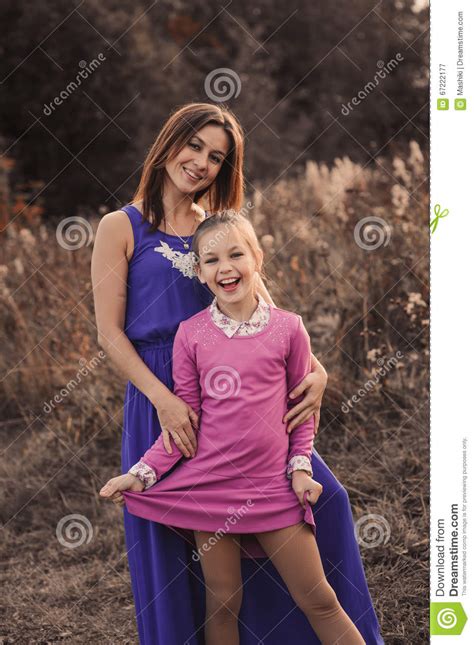 lifestyle capture of happy mother and preteen daughter