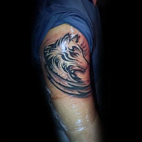 Top 43 Tribal Wolf Tattoo Ideas [2020 Inspiration Guide]