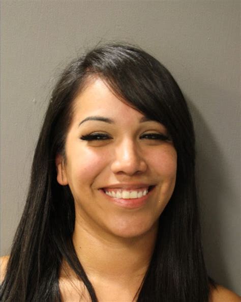 woman all smiles after being arrested for fleeing police
