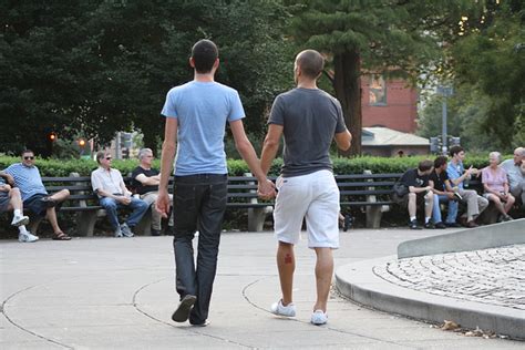 a straight man holding hands with another straight man for