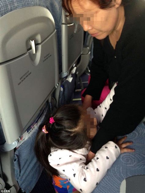 Photos Show Air China Passnger Allow Granddaughter To Urinate On The