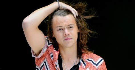 one direction s harry styles has straightened his hair and no one is
