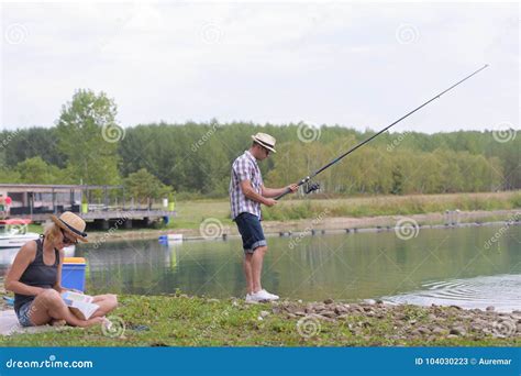 beautiful couple catching fish stock image image  female fish