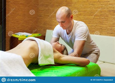 Masseur Works On Woman Arms Doing Traditional Thai Massage On Female
