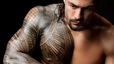 photos see the tattoos of superstars like roman reigns seth rollins and more roman reigns