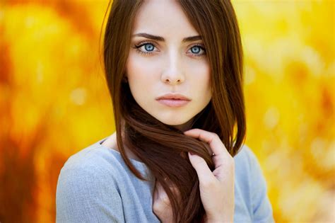 women auburn hair blue eyes face blurred long hair