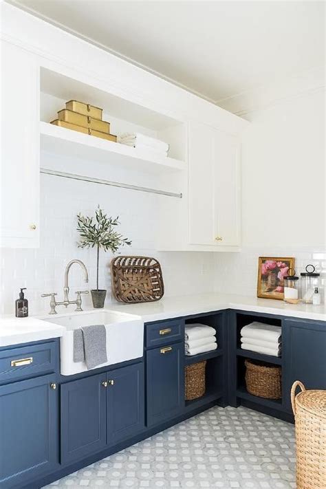 toned modern farmhouse laundry  dark blue  cabinets
