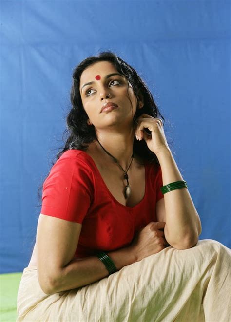 film actress hot images swetha menon showing her back in red blouse