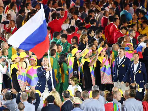 Volleyball Player Sergey Tetyukhin Carrying The Russian Flag Leading