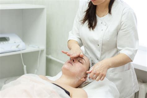 Facial Massage The Cosmetologist Makes A Facial Massage For An