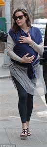 liv tyler swaddles newborn son sailor in a blue scarf while returning