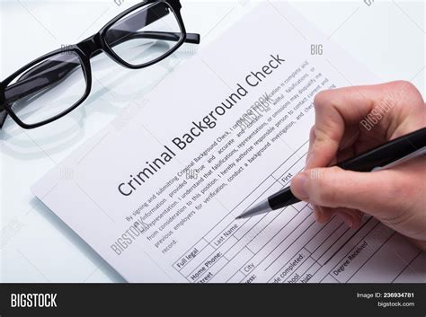 🔥 person filling criminal background check form 236934781 image