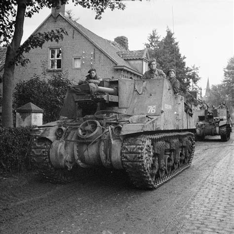 sexton 25 pdr self propelled guns of 11th armoured division pass through deurne during the