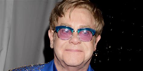 elton john s rep says pics of him carrying a dolce and