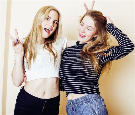 Two Blond Teenage Girl Fooling Around Messing Hair Stock Image Image