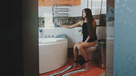 Girl Sitting On Toilet Black Stock Footage Video 100