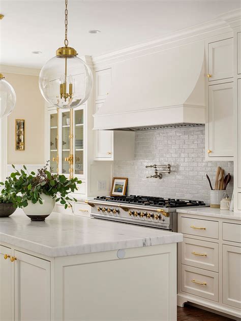 white shaker kitchen cabinets  brass hardware cabinets matttroy