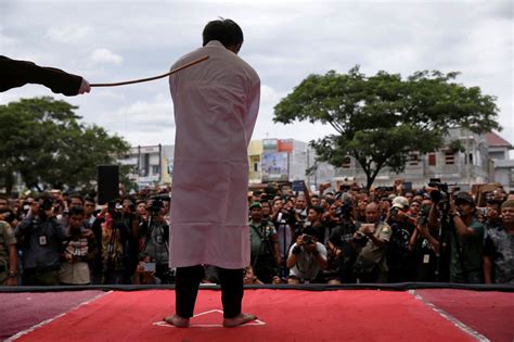 indonesian men caned for gay sex before jeering crowd