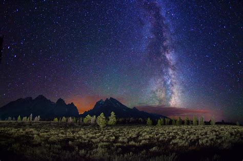 starry night night stars landscape milky  trees mountain clouds long exposure galaxy