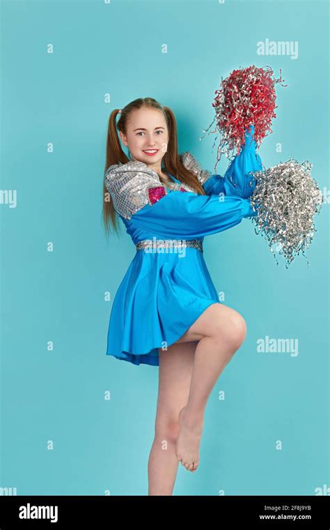 Portrait Of Young Cheerleader Girl From Cheerleading Group Turquoise