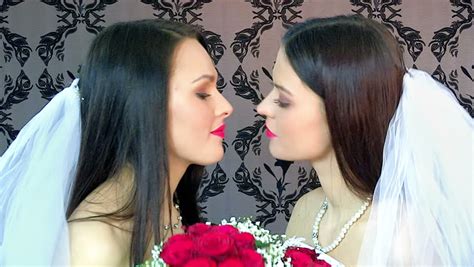 Lesbian Women With Flowers Bouquet Kissing In Erotic