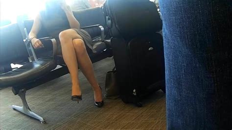 candid sexy crossed legs and feet in heels at airport