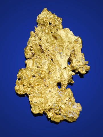 gold nuggets   blue background      image