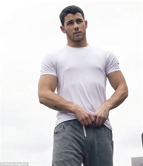 nick jonas flashes his guns on the cover of attitude magazine daily