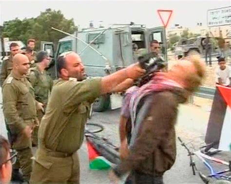 israeli military officer suspended for striking activist with rifle