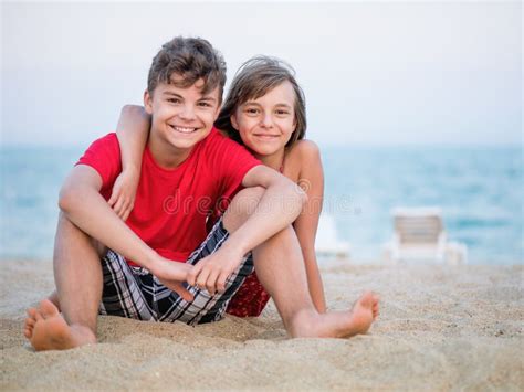 Brother And Sister Playing On Beach Stock Image Image Of Emotion