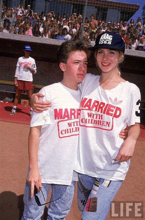 actors david faustino and christina applegate wearing married with