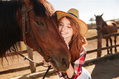 Premium Photo Happy Tender Young Woman Cowgirl Standing And Hugging