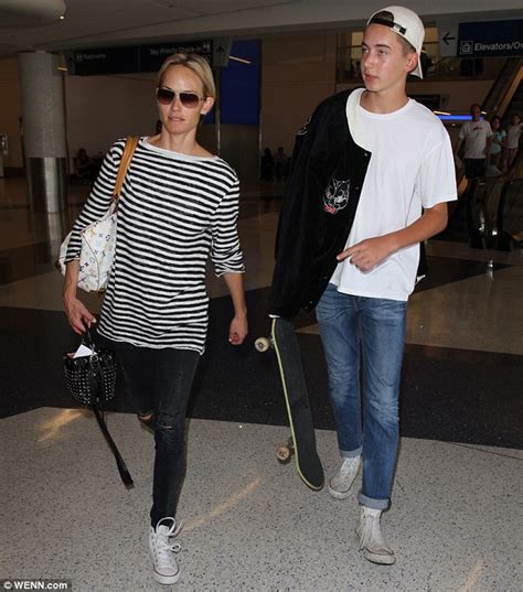 Amber Valletta With Teen Son Auden While Touching Down At Lax Airport