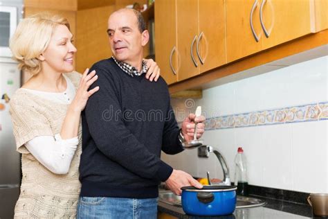 Husband Helping Wife To Cook Stock Image Image Of Elderly Interior