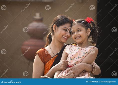 Portrait Of Loving Indian Mother And Daughter At Village Royalty Free