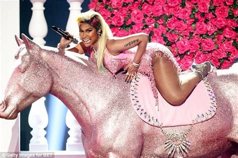 Photos Nicki Minaj Puts Up Sexy Display In Racy Red Dress During Bet