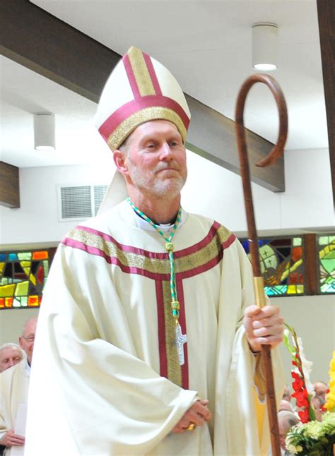 giving     bishop  catholic messenger