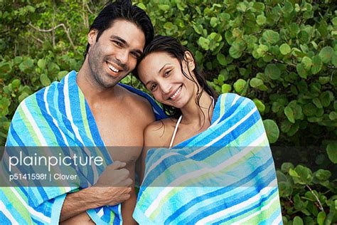young couple wrapped  towel portrait stock image everypixel