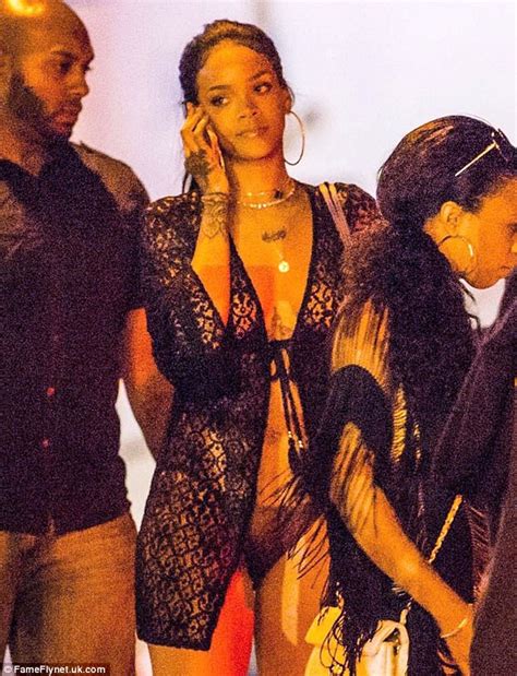 rihanna shows off taut tummy in strapless bathing suit in st barts