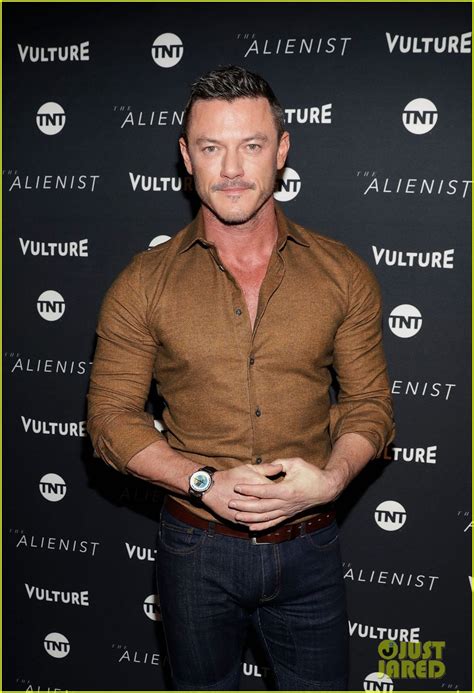 luke evans looks sexy in form fitting button down at sundance 2018