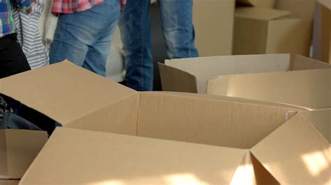 opened cardboard boxes people are moving out stock footage sbv