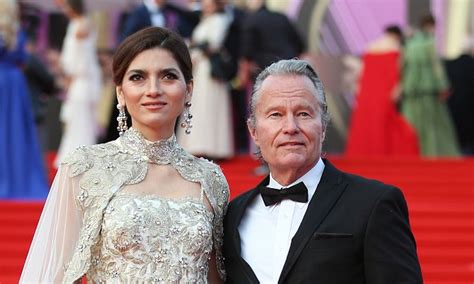 blanca blanco 37 dazzles in caped gown as she joins beau john savage 68 at moscow film
