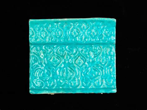 bonhams a kashan monochrome moulded pottery tile persia 12th 13th