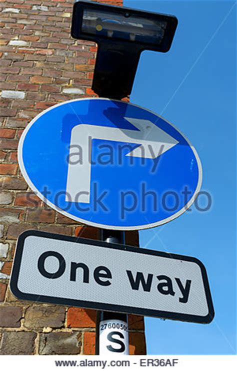 uk road sign   street traffic streets white arrow blue stock photo  alamy
