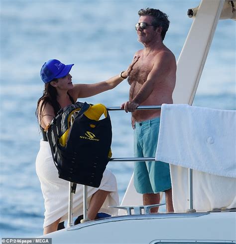 simon cowell s girlfriend lauren silverman rubs sun cream onto his