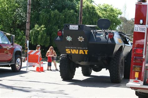 swat tank leaves   crowd    agencies  flickr