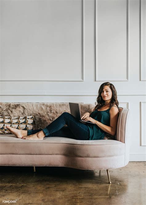 Female Blogger Sitting On A Couch Premium Image By